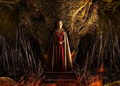Rhaenyra stands in front of the Iron Throne, with a dragon behind her.