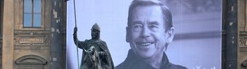 A banner honoring Václav Havel hangs from the National Museum at Wenceslas Square in Prague, with an equestrian statue of Saint Wenceslas in the foreground. (David Sedlecký/Wikimedia Commons)